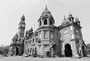 Black and white photograph of the New Palace, an iconic architectural landmark in Kolhapur, India.
